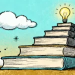 A stack of trading and finance books beside a laptop showing price charts