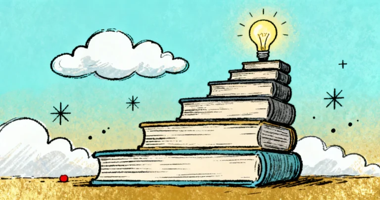 A stack of trading and finance books beside a laptop showing price charts